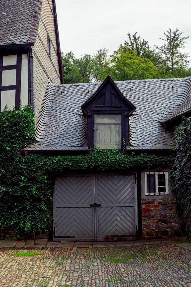 Blue craftsman-style residential garage door in a Portland-area neighborhood